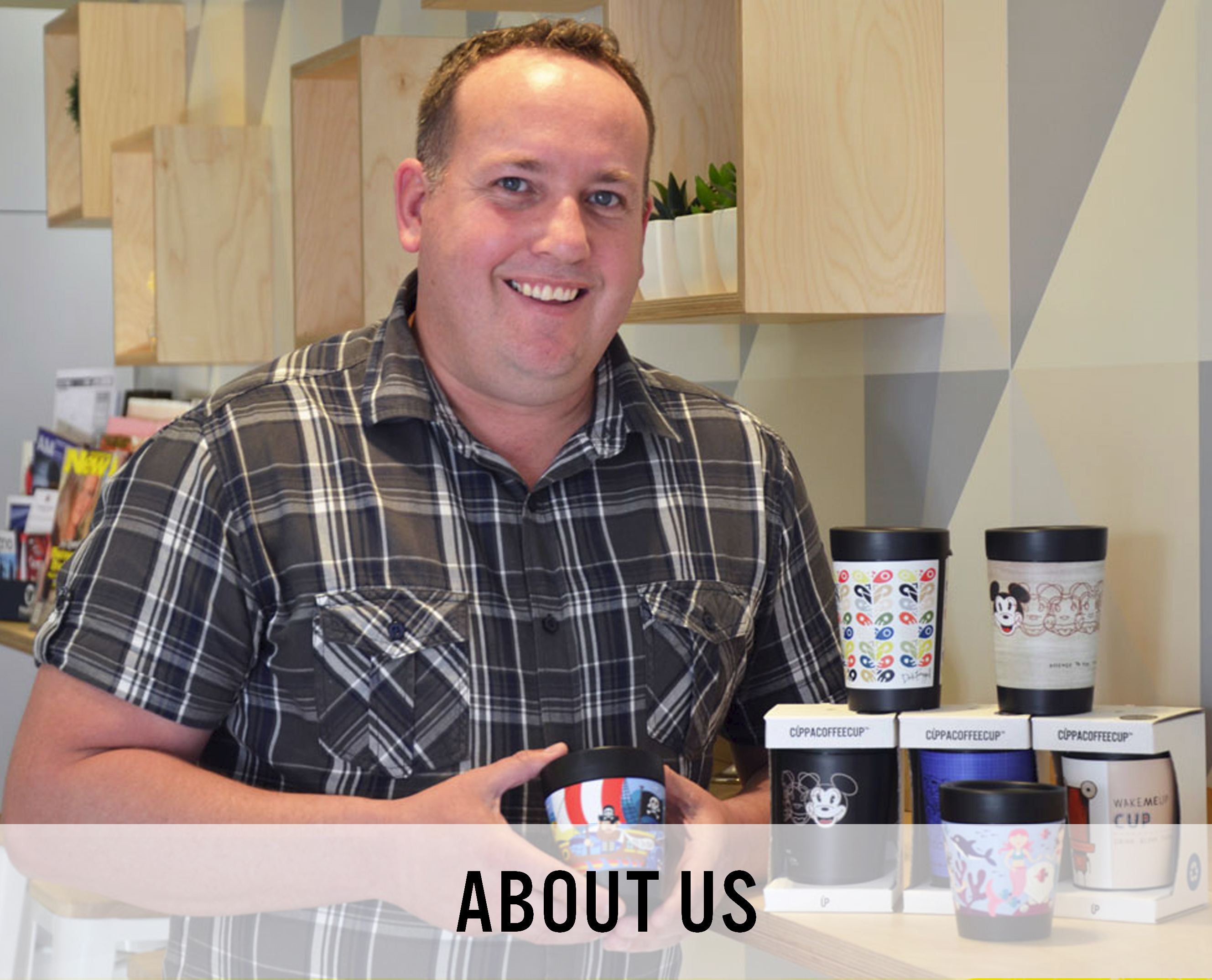 A picture of Darren Turner, General Manager of Cuppa Coffee Cup holding a Recyclable Coffee Cup